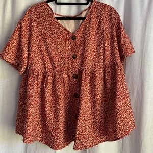 red blouse with flower detail